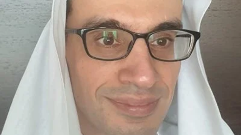 Abdulla Galadari, wearing glasses and head covering