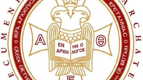 Cross with open book with Greek characters, encircled by words "Ecumenical patriarchate"
