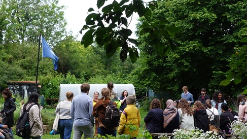 Summer School participants in a community garden 