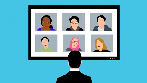 Suited person viewing six participants in a conference call