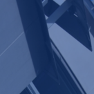 Architectural detail showing cylindrical roofline and blue sky