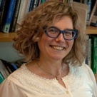 Prof Esra Özyürek with bookshelves