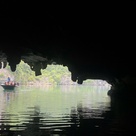Boat passing into a sea cave - Ha Long, Vietnam