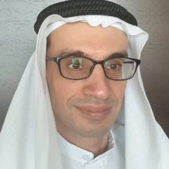 Abdulla Galadari, wearing glasses and head covering