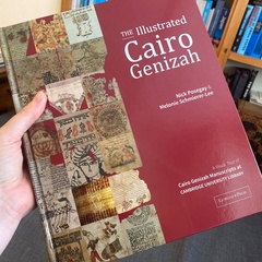 Detail of book cover, held to camera