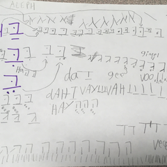 A child's exercises, writing out letters from the Hebrew alphabet with vocalised transliterations (far left)