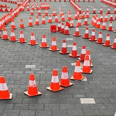 Intersecting lines of traffic cones indicating a complex pathway