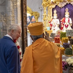 Charles half-turned to his host, listening