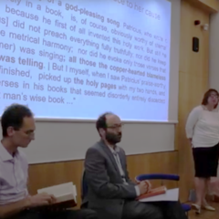 The three guests seated in front of a slide, Dr Lefteratou standing at lectern, Professor Van Kooten chairing questions. 