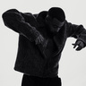 Three-quarter view of Mula B in silhouette, arms out, hands down, leaning forward  