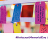 Colourful luggage tags hanging. Each has a handwritten message. Two pledges are legible: "I will, teach younger people about the Holocaust to make sure it is never forgotten. "I will continue to educate others and raise awareness about the Holocaust" 
