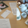 Photos from the start of the day - Registration table with sign-in sheet and programme, plus coffee and pastries awaiting attendees.