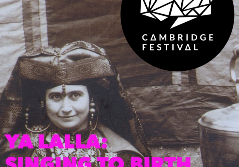 A finely dressed woman, behind her the wall of a tent