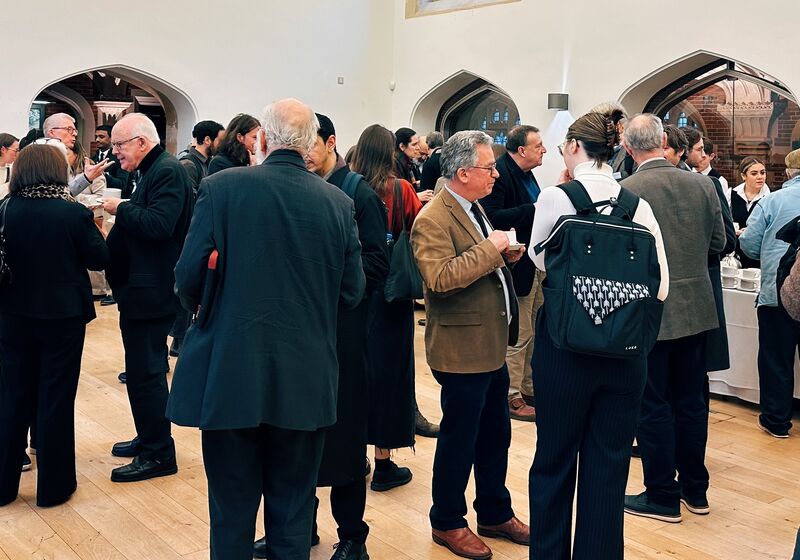 Animated clusters of people chatting over coffee