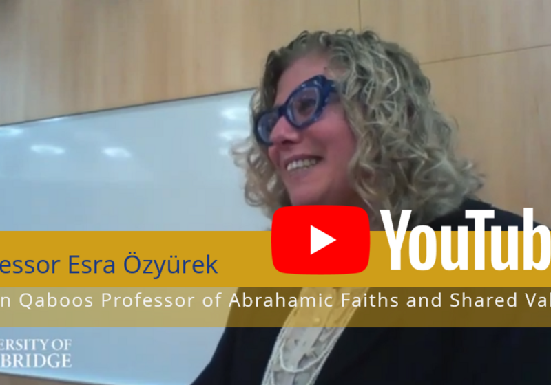 Professor Özyürek delivering her lecture, with overlaid label identifying her, and YouTube logo