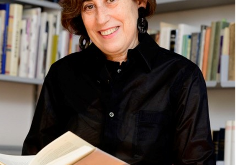 Professor Frishman, surrounded by books