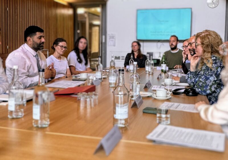 Lord Khan and others in dialogue