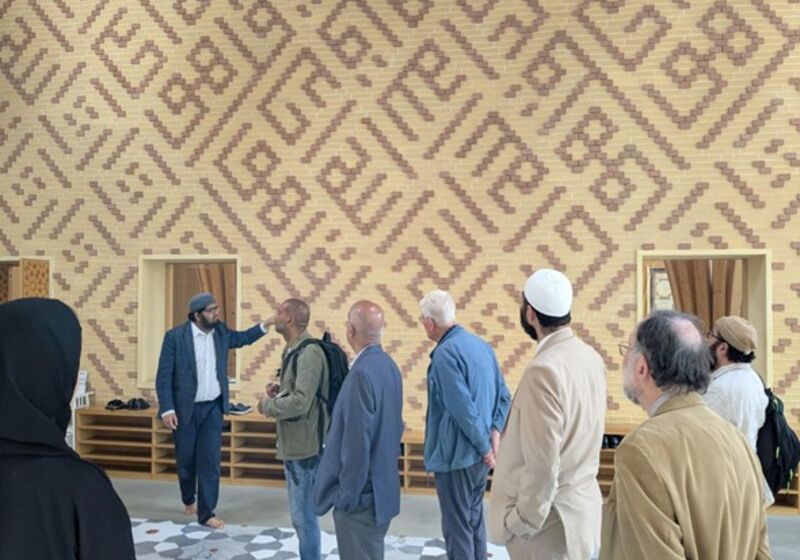 The visitors look up mid-tour of Cambridge Central Mosque