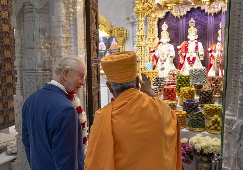 Charles half-turned to his host, listening