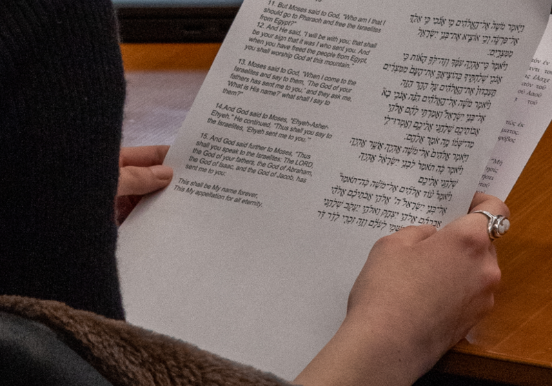 A participant studies text from Exodus