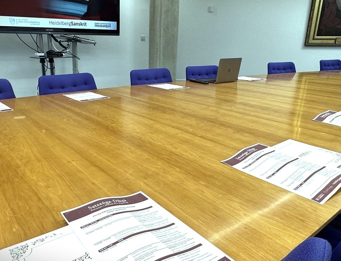 Large oval table set up for event