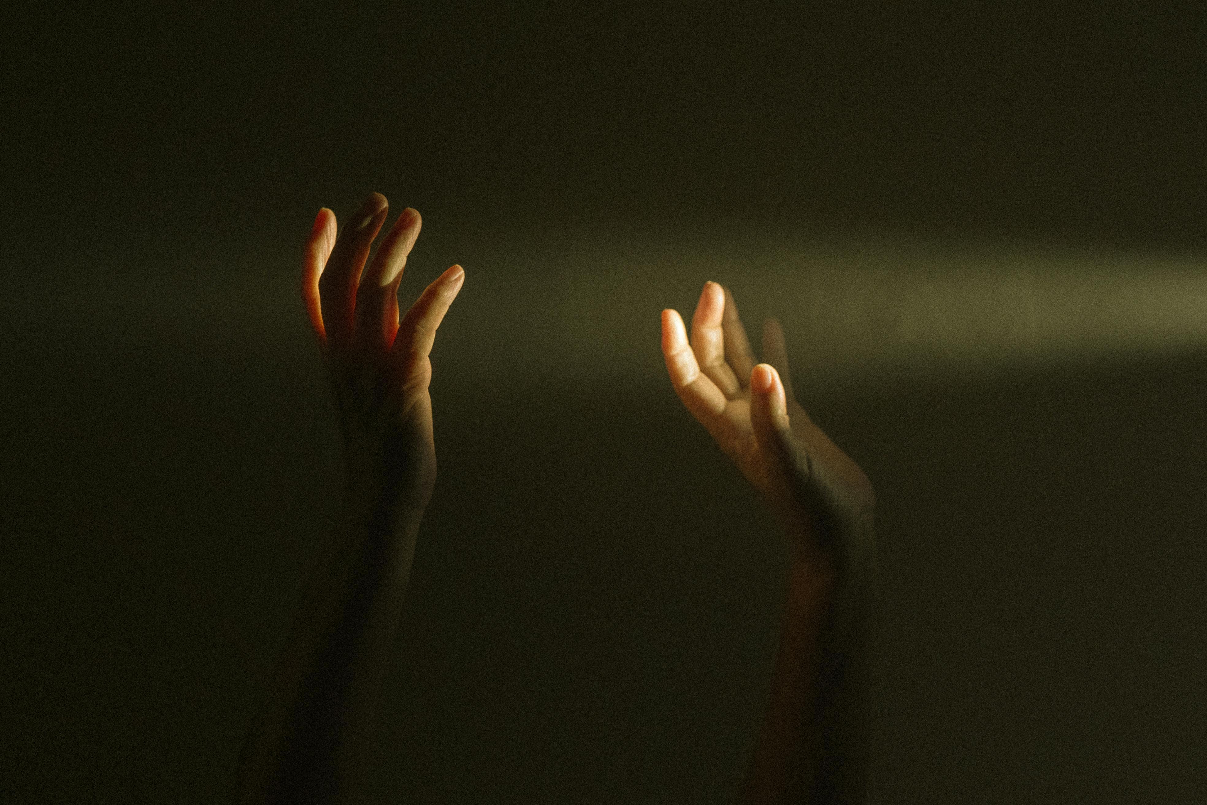 Hands uplifted – original photograph by Luis Dalvan via pexels.com (2020) Hands raised up towards light