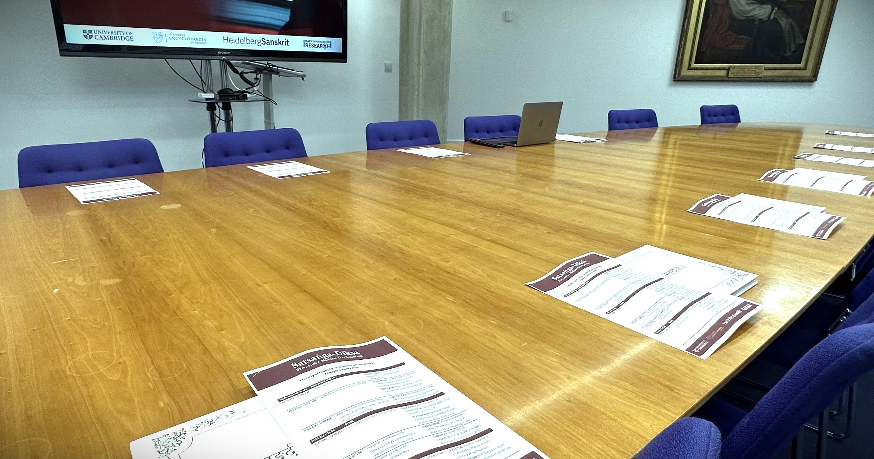 Large oval table set up for event